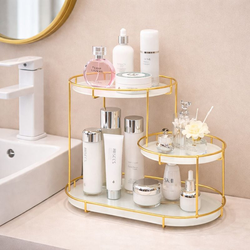 Bathroom counter with a gold and white organizer holding various skincare products.