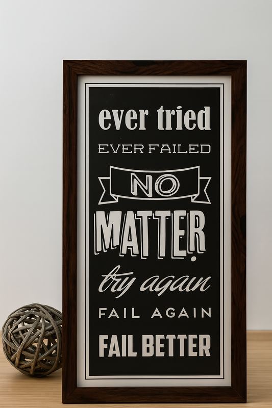 Framed motivational quote print: “Ever tried. Ever failed. No matter. Try again. Fail again. Fail better” in black and white with wooden frame.