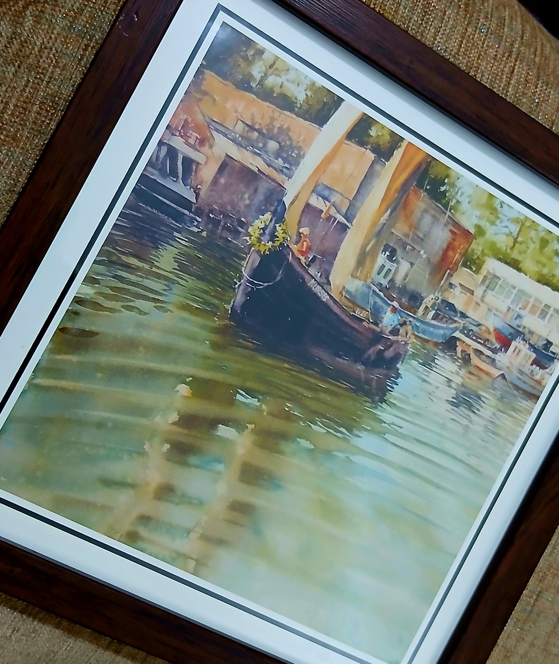 Framed photo of a sailboat in a harbor with beige sails, compact 8.5 x 8.5 inch wall art in a wooden frame.