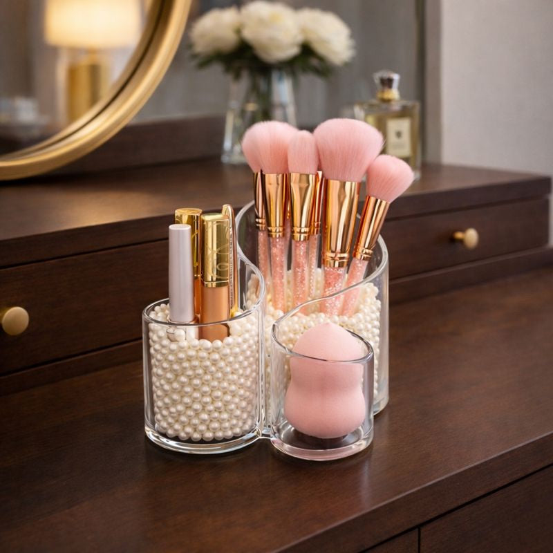 Makeup brushes and products in an organizer on a wooden dresser.